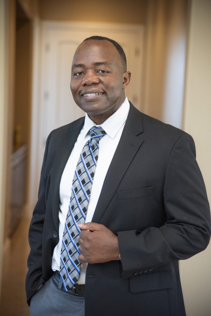 Man in suit smiling confidently