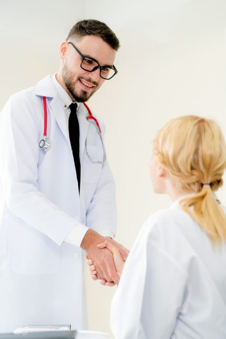Doctor shaking hands with patient