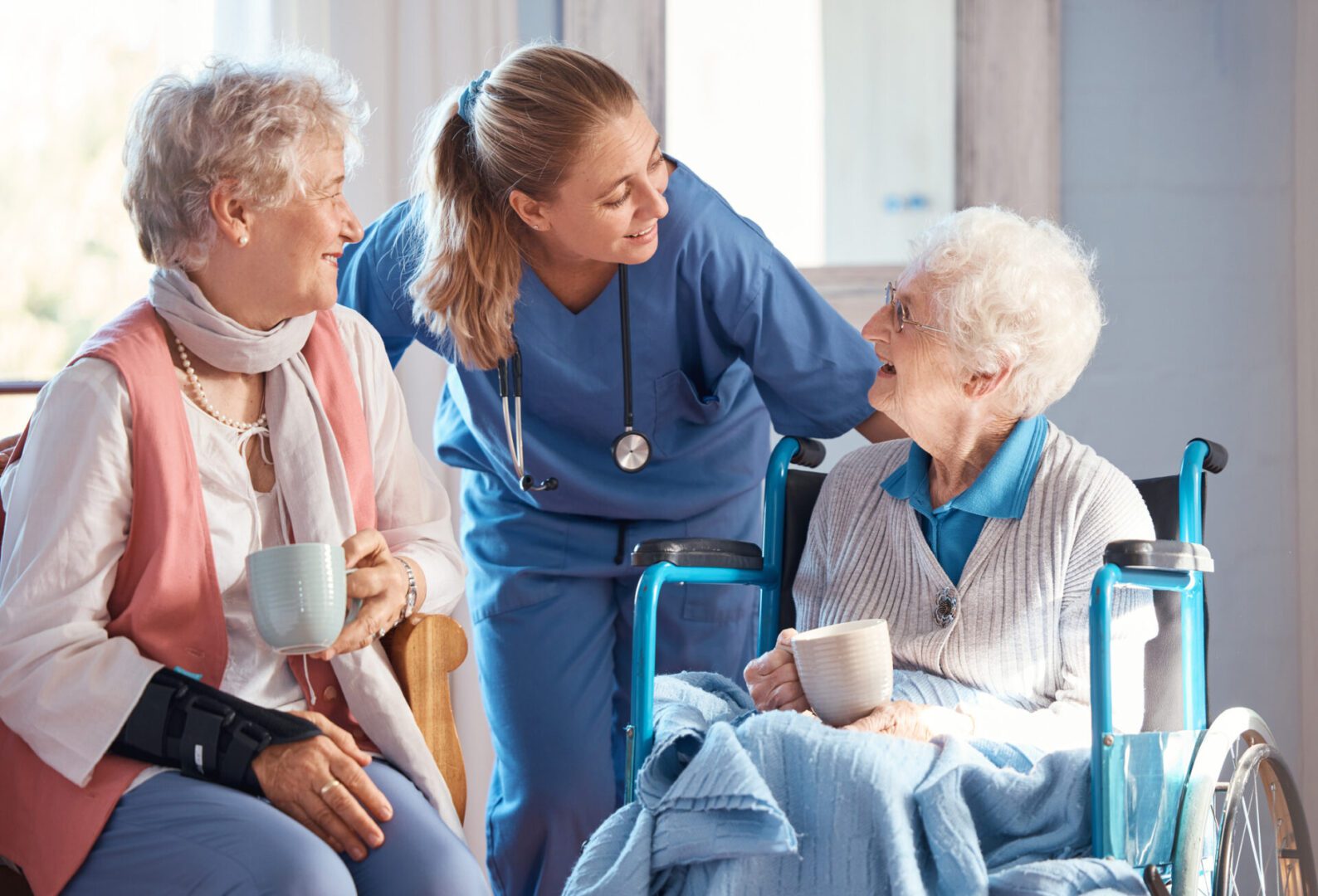 Friendly nurse assisting elderly patients