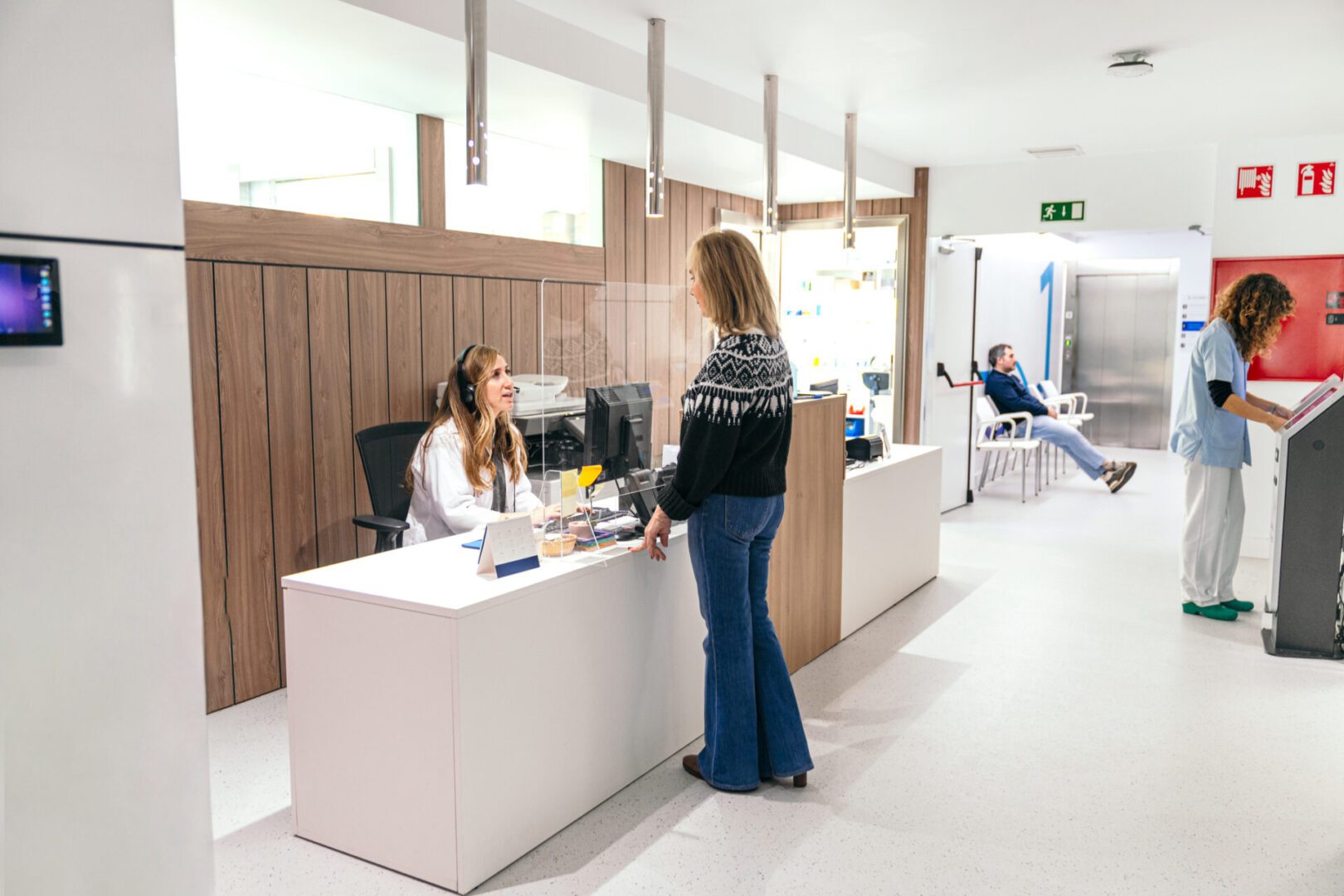 Woman consulting at medical front desk